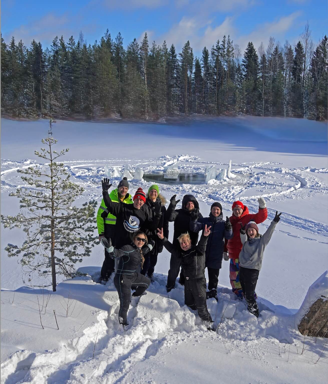 Arctic Divers group celebrating after ice diving in Finland in winter