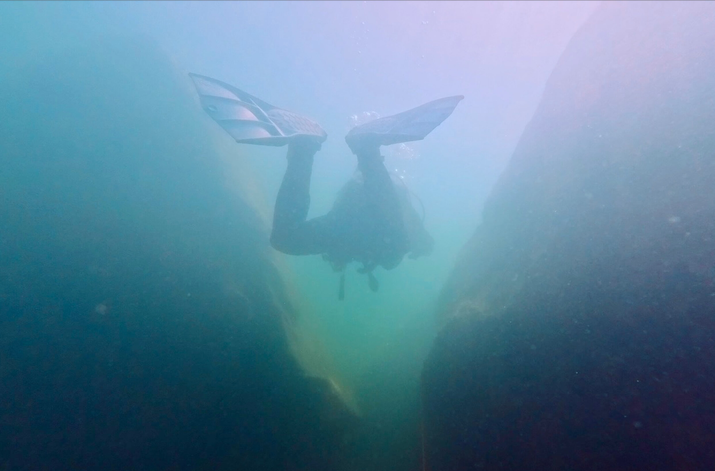 Scuba diver exploring a shipwreck in the Bay of Helsinki Finland