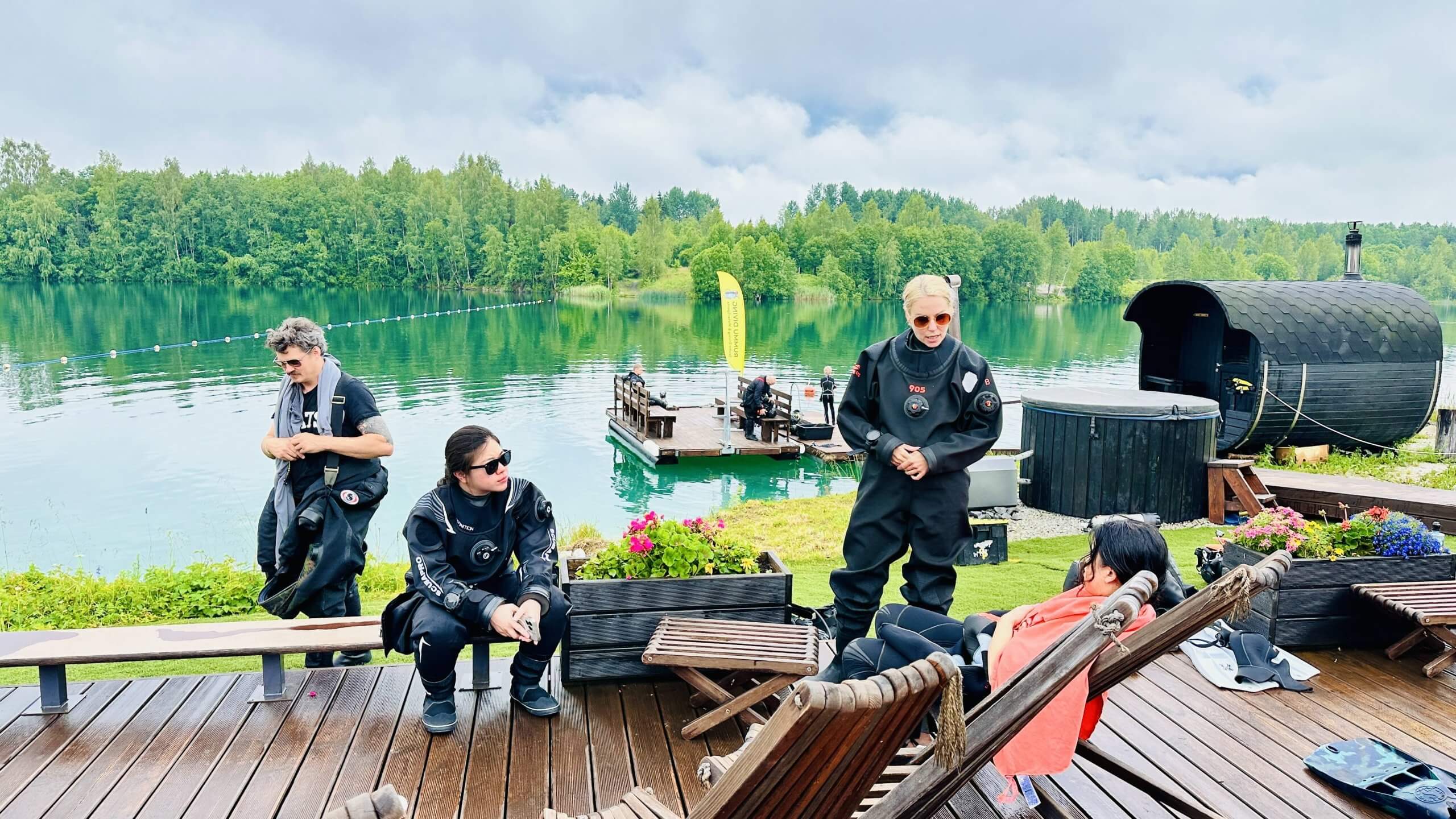 Arctic Divers group at Rummu quarry Estonia with turquoise water and sauna